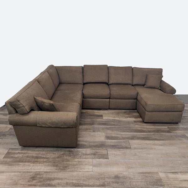 sectional sofa in brown color with a square shape and a square shape.