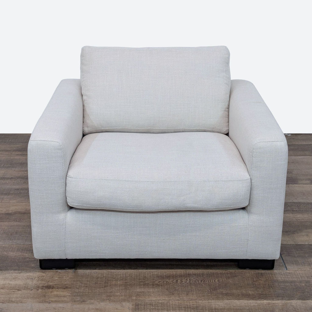 Front view of a Stone & Beam lounge chair with plush cushioning and neutral light gray fabric.