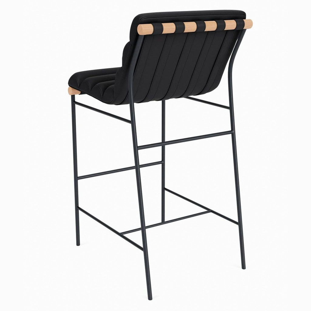 Side angle of modern black barstool featuring solid wood dowels and sleek powder-coated steel frame.