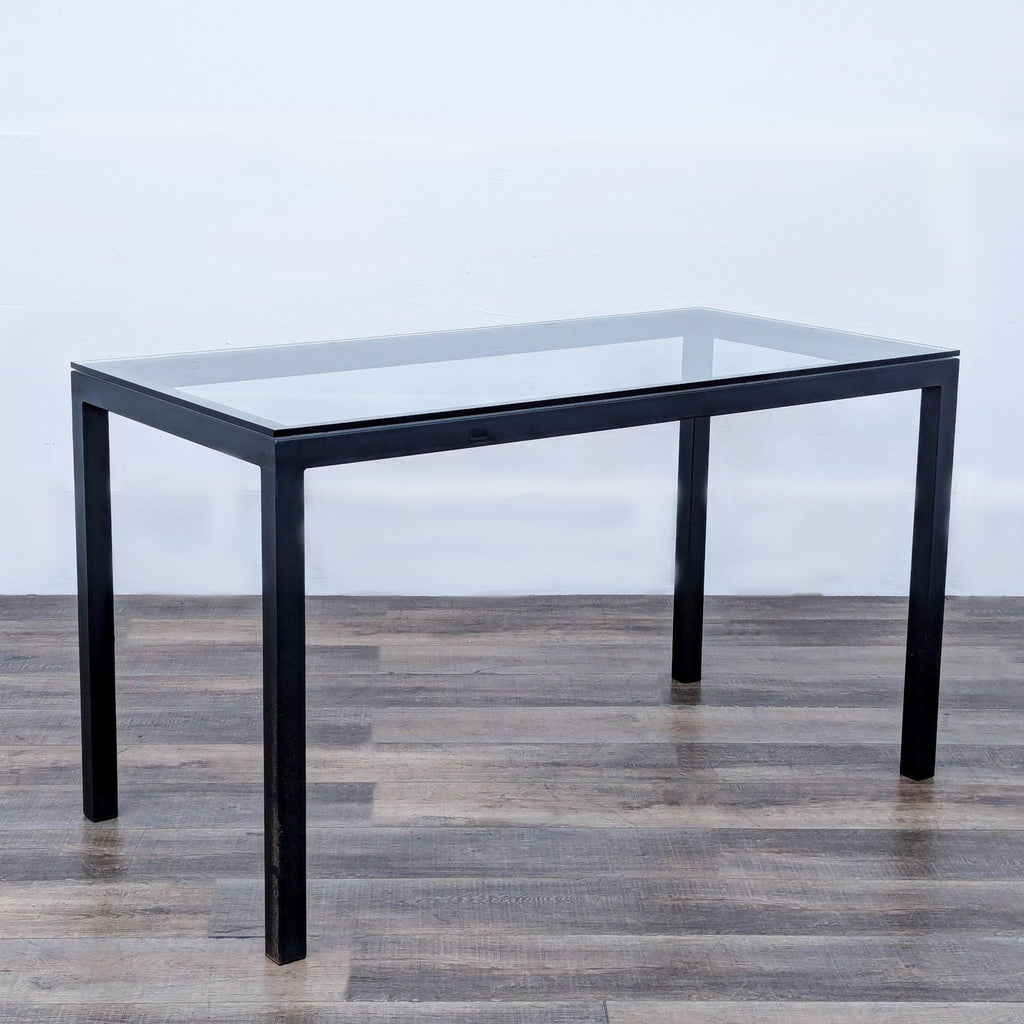 a black glass and metal coffee table