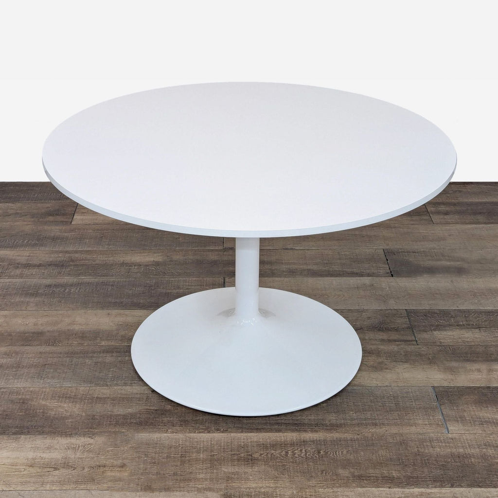 the [ unused0 ] round white table with glass top