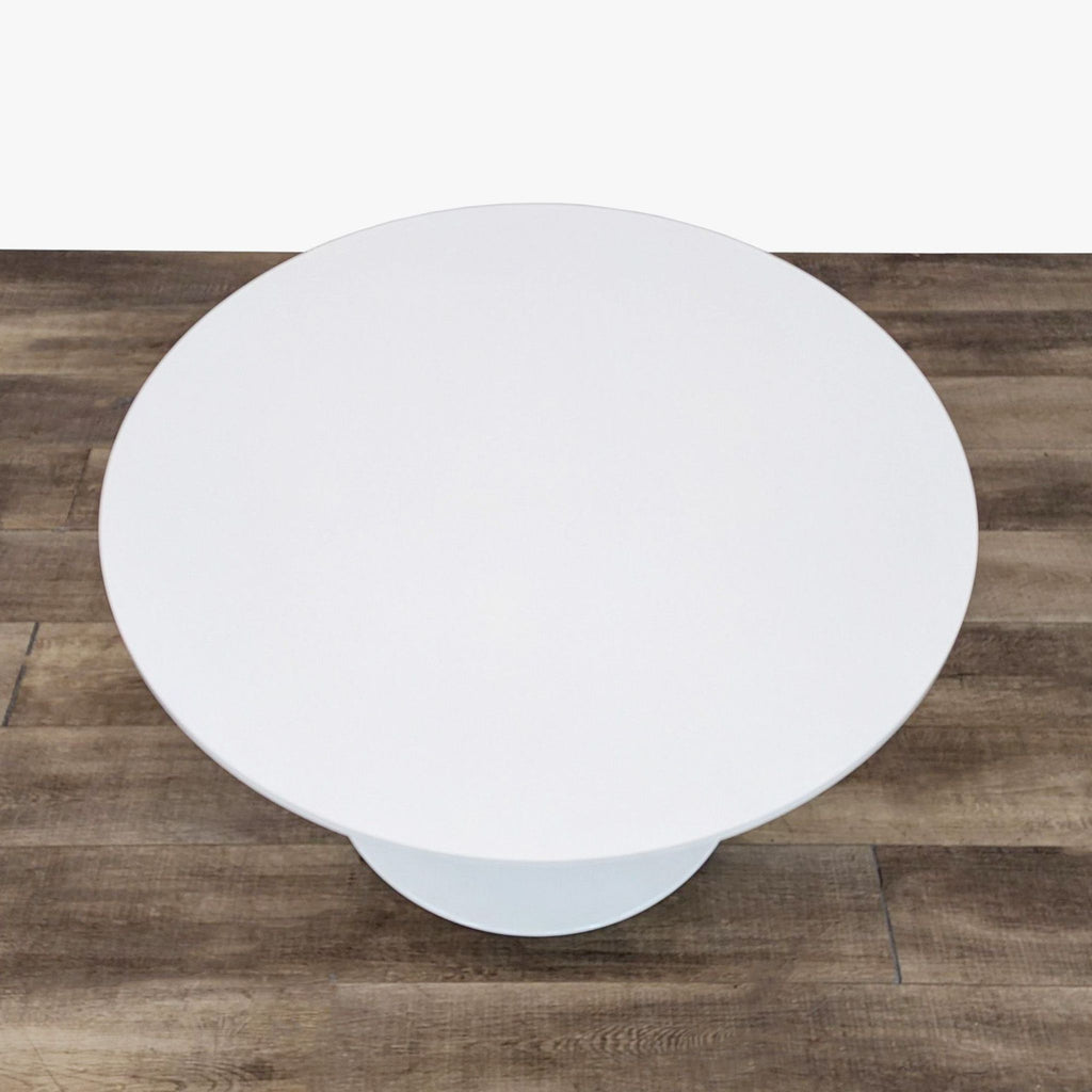 the [ unused0 ] coffee table with a white base