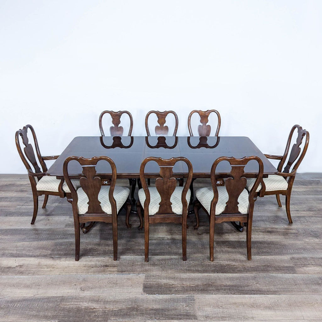 a set of six dining chairs and a table.