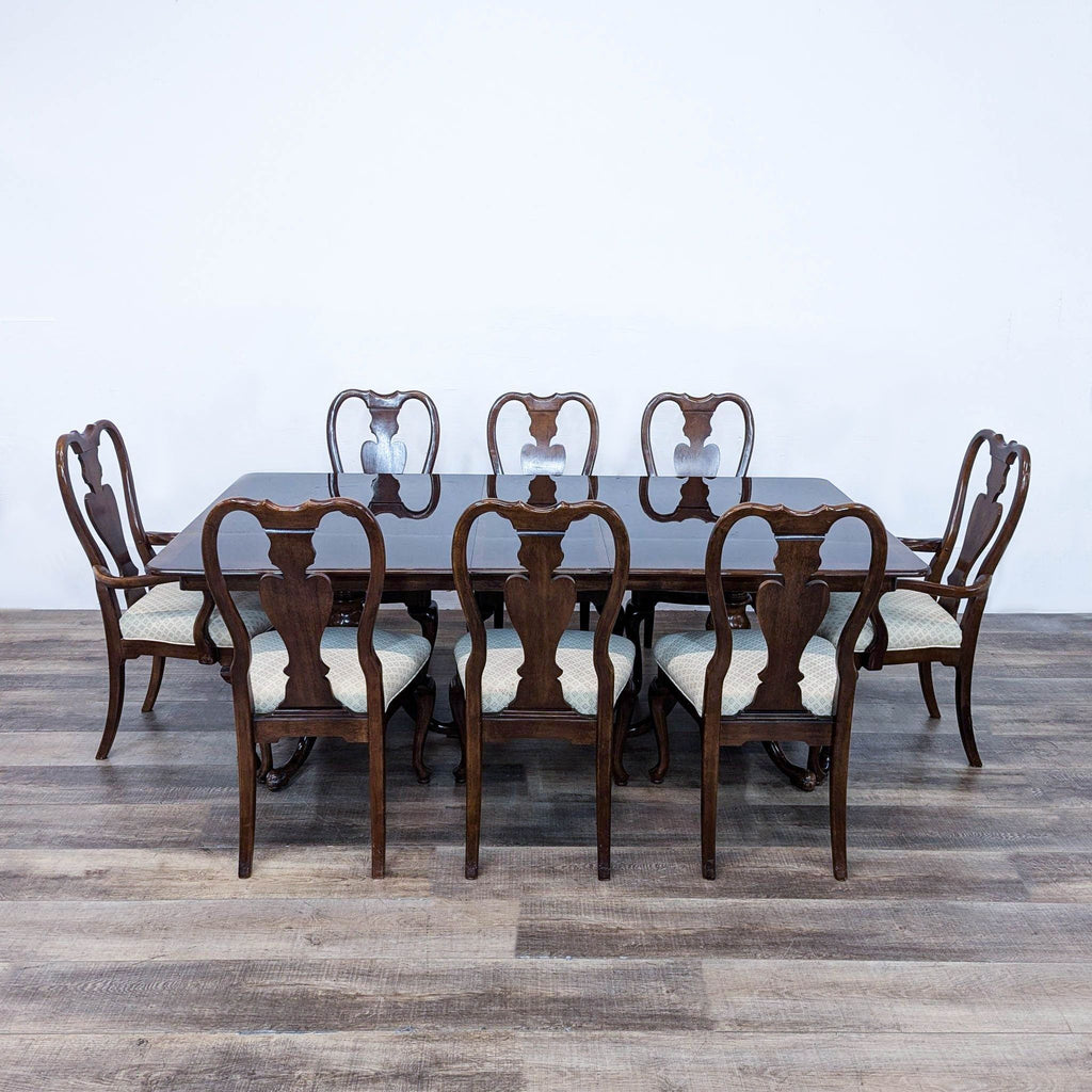 a set of six dining chairs and a table