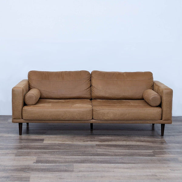 a pair of leather sofas in the style of [ unused0 ], italy, circa 1970