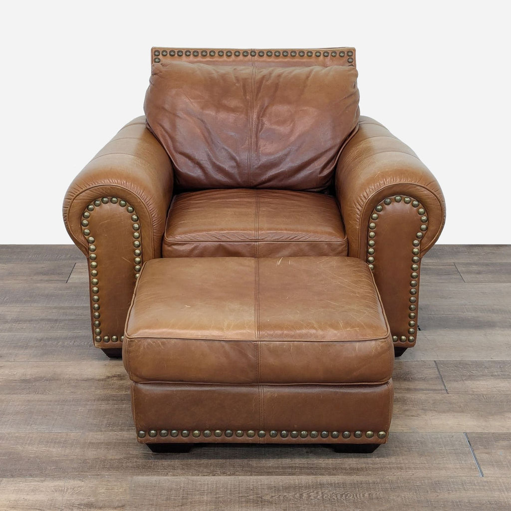Side view of Rustin brown leather lounge chair with nailhead trim and ottoman, brand Reperch.
