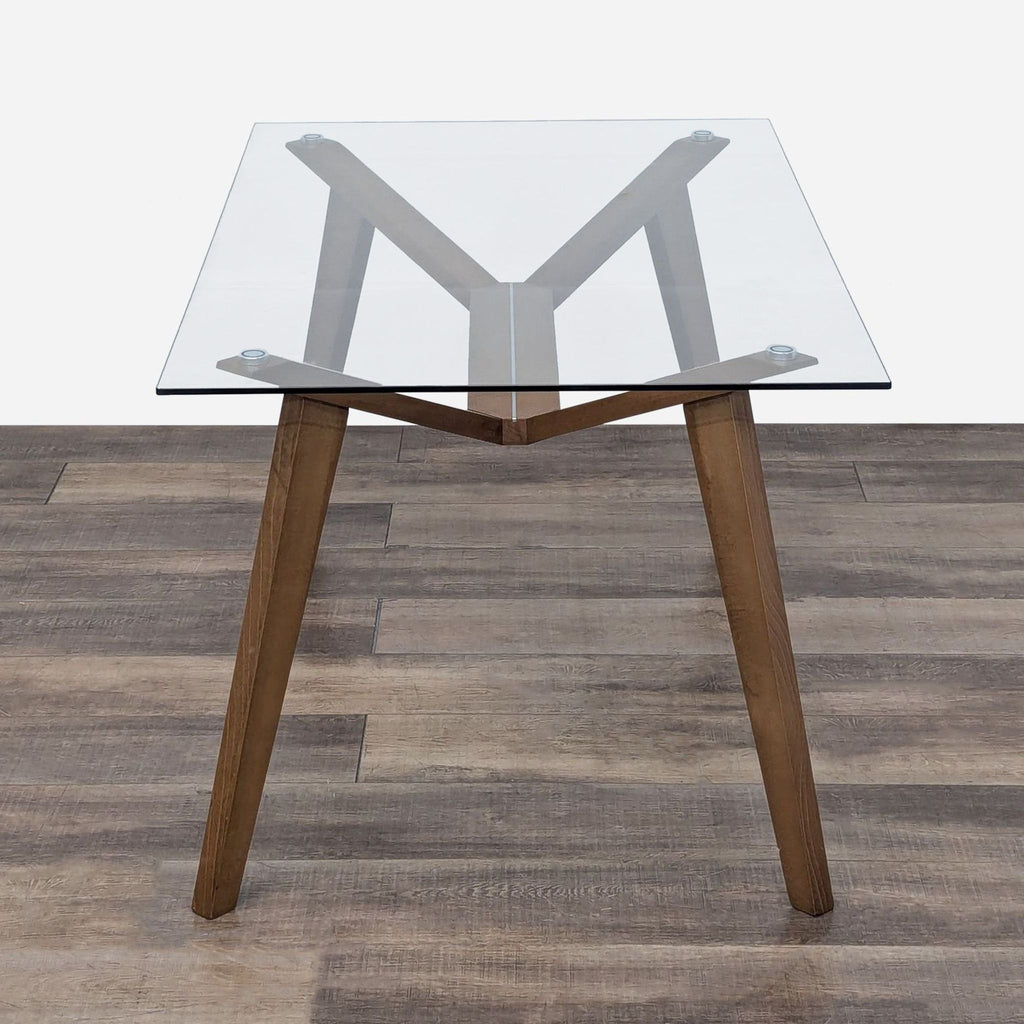 a glass table with a metal frame.