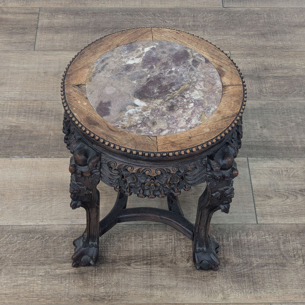 a carved wood and stone table, 19th century