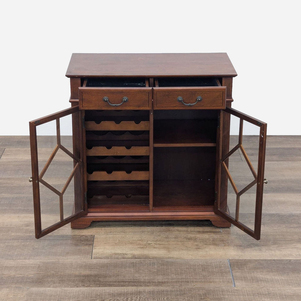 a small, mahogany desk with a glass door and a metal shelf.