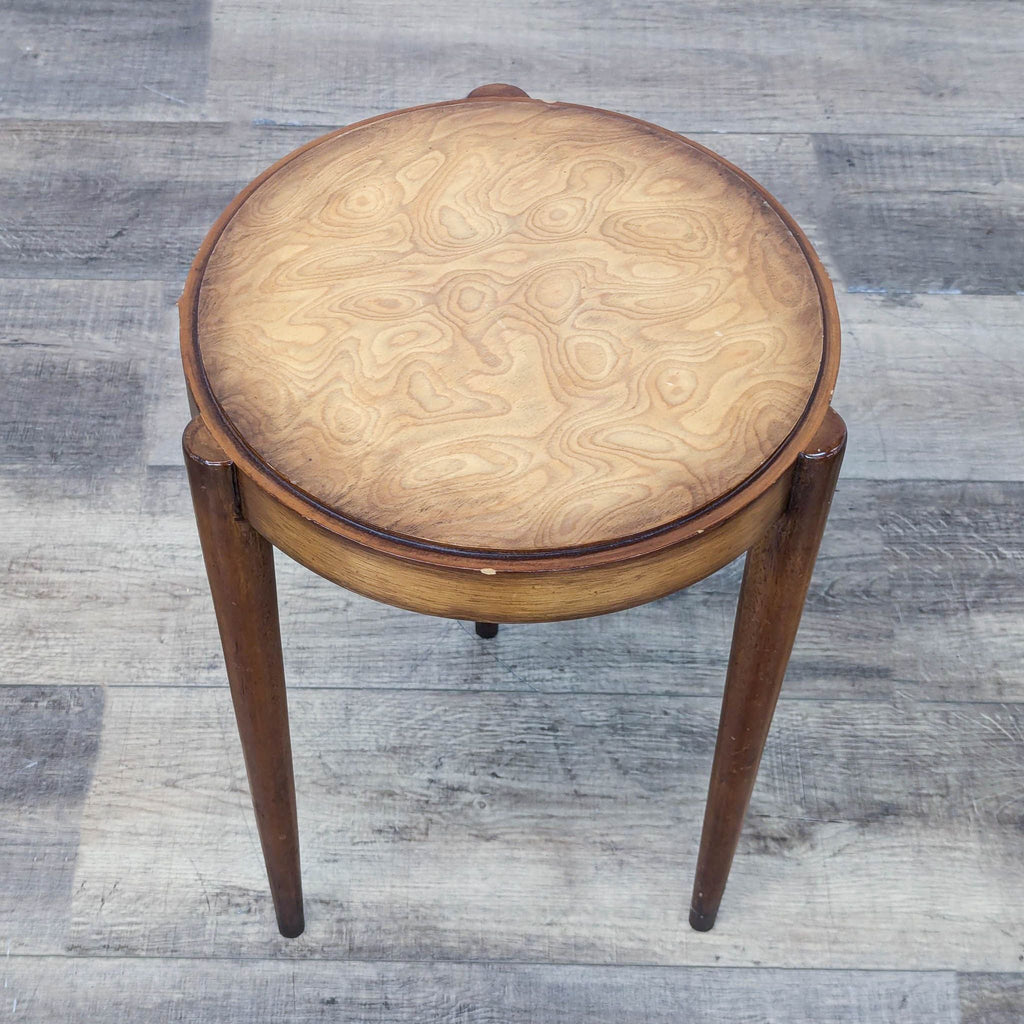 a vintage side table with a round top and a round top.