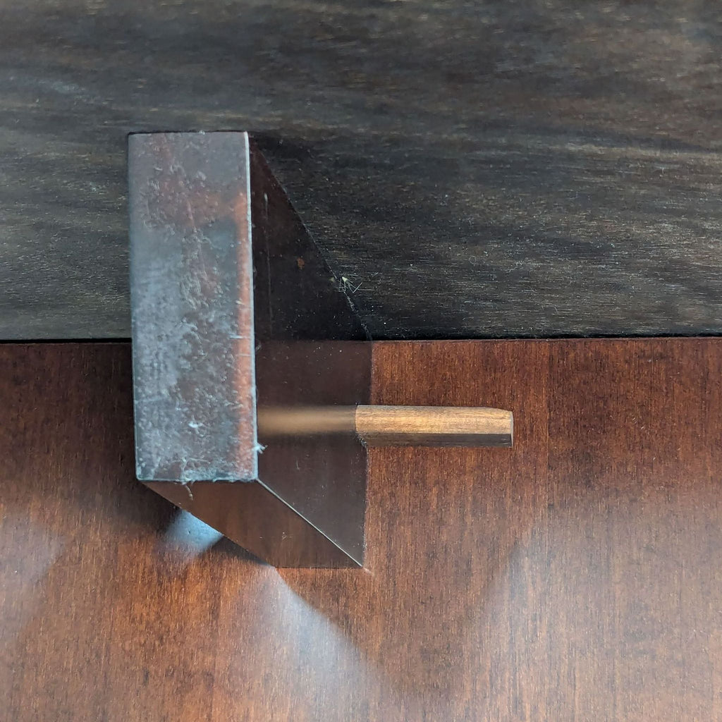 a metal hammer on a wood table.