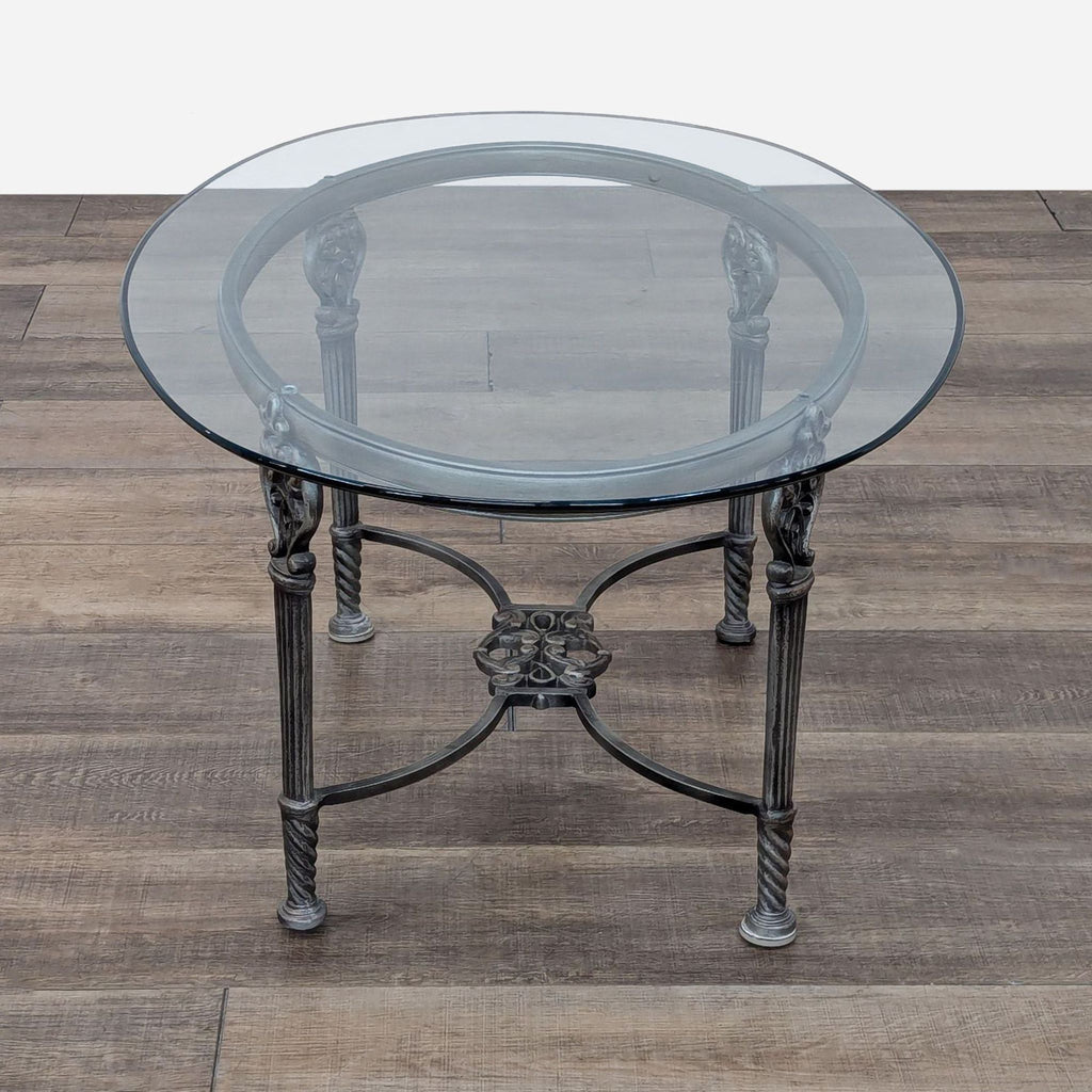 a round glass top coffee table with a glass top.