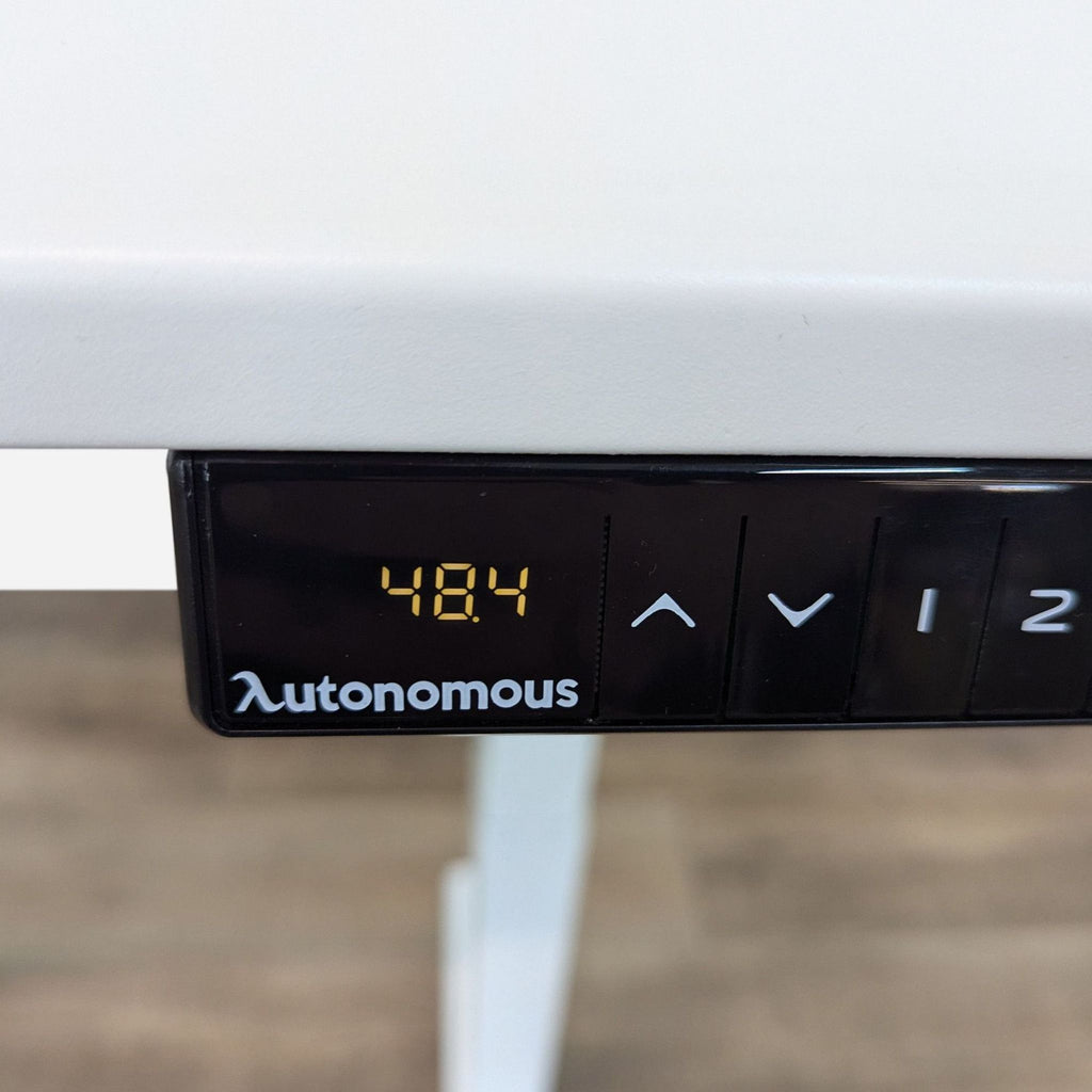 Close-up of the Autonomous desk height control panel displaying a height of 48.4 inches.