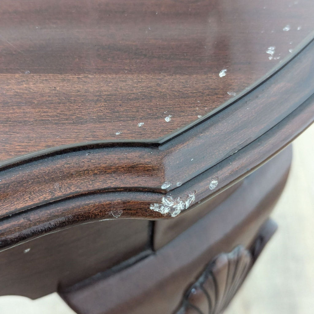 a close up of a table top with a chipped edge.