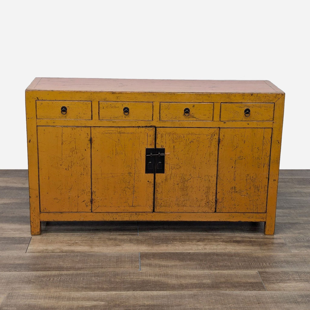 a mid century painted yellow buffet cabinet