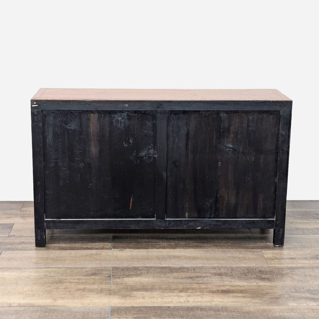 a vintage black painted wood and metal sideboard.