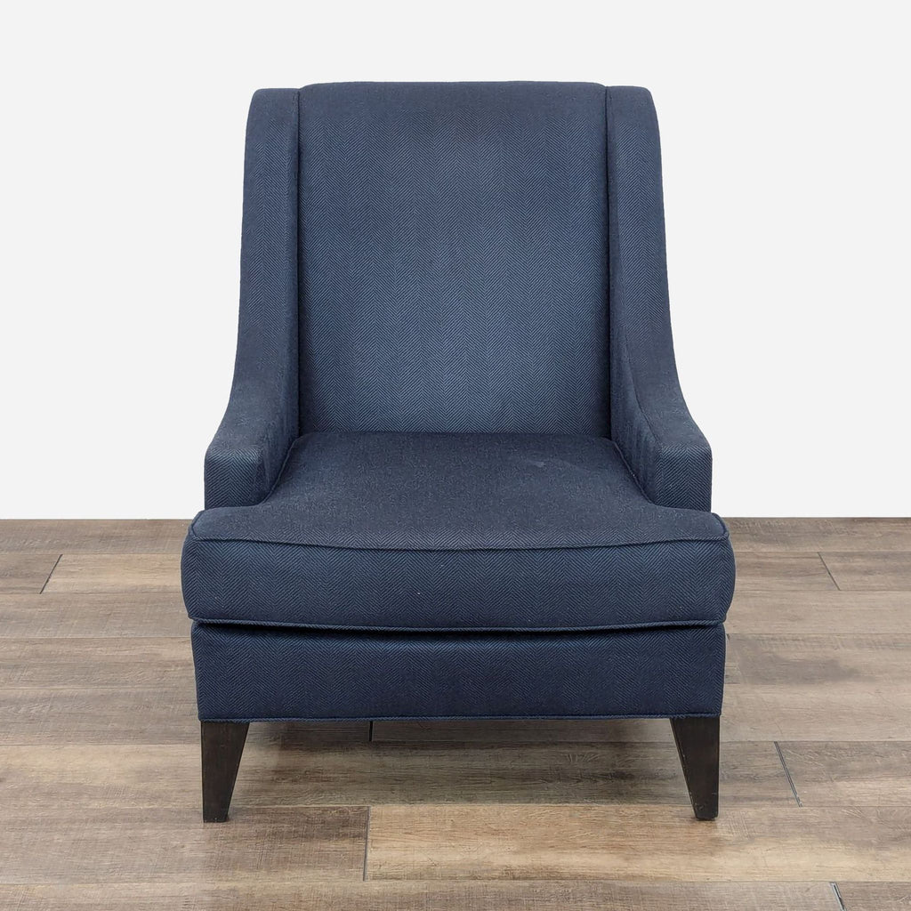 a blue chair with a dark blue fabric