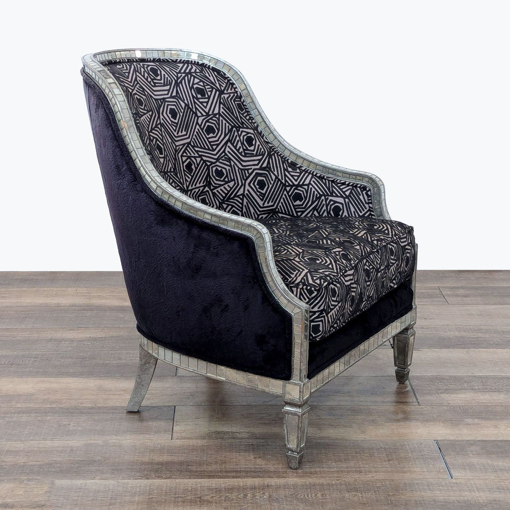 a black velvet upholstered armchair with a black velvet upholstery.