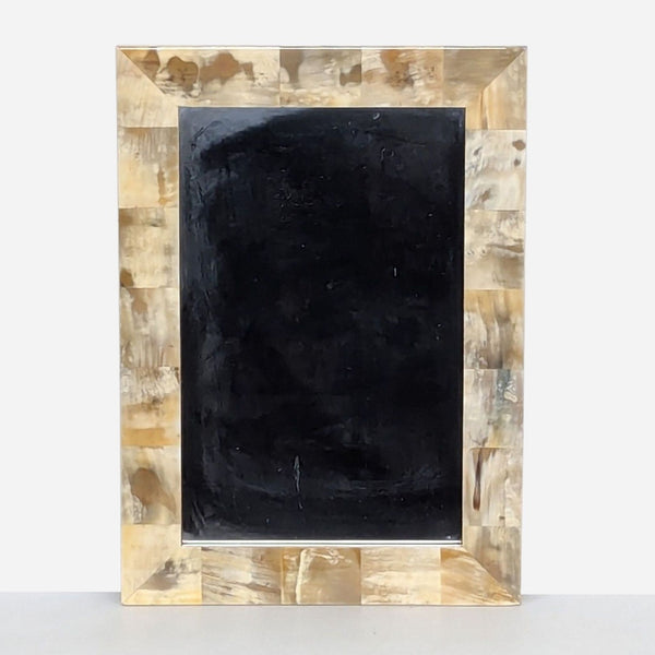 a framed oil on canvas painting of a black and gold frame.