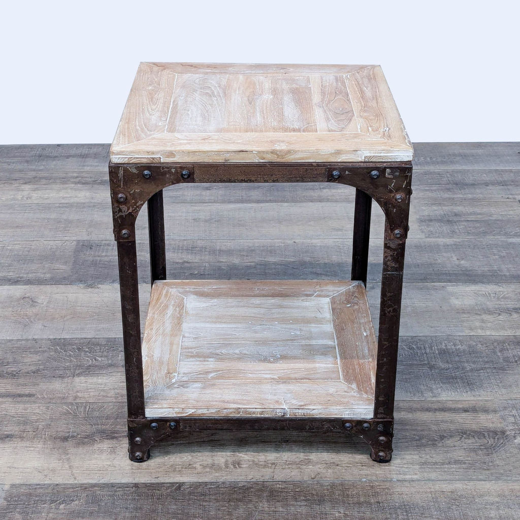 a rustic industrial style side table with a shelf.