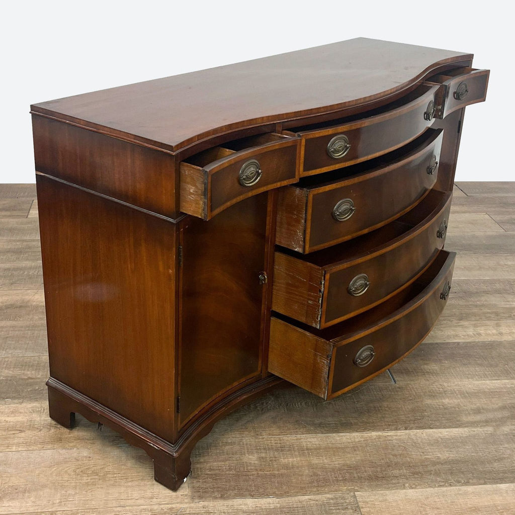 a mahogany three drawer sideboard with a drawer and a drawer.