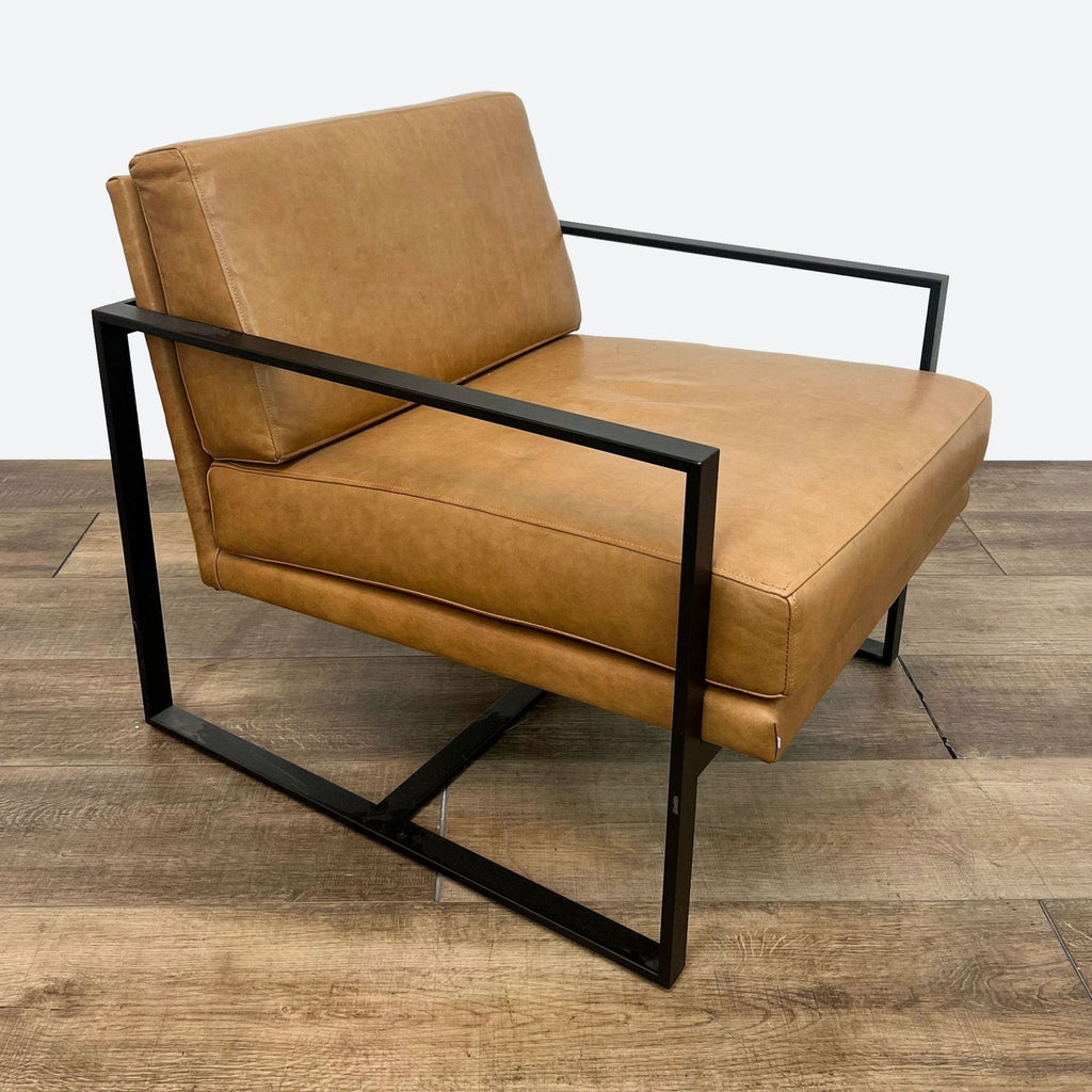 a pair of leather lounge chairs