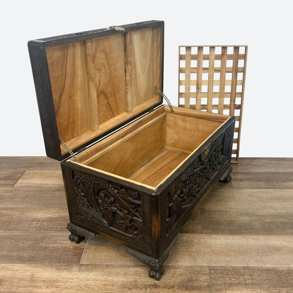 a 19th century spanish carved wood chest with a carved top.