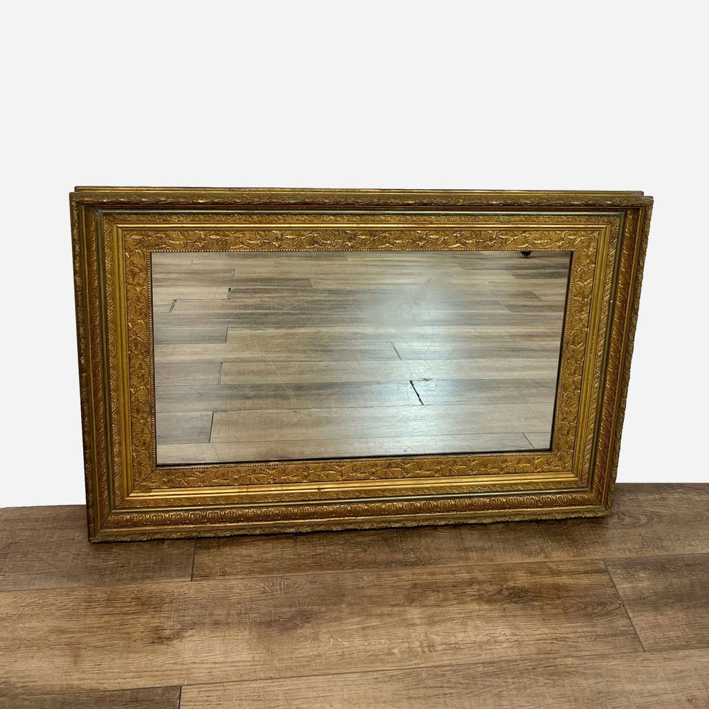 a vintage french carved wood framed mirror