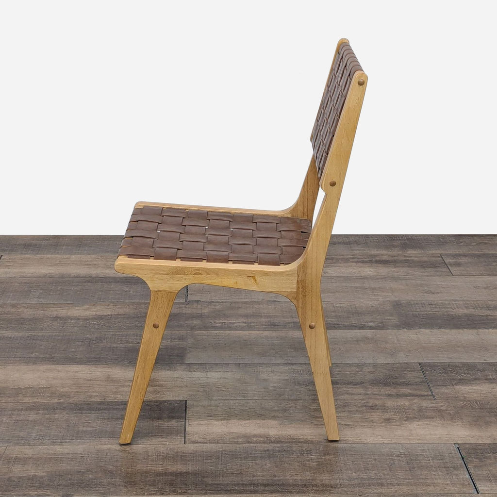 the chair is made of solid wood and has a leather seat.