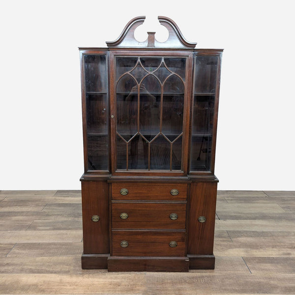 a mahogany display cabinet with glass doors and a glass door.