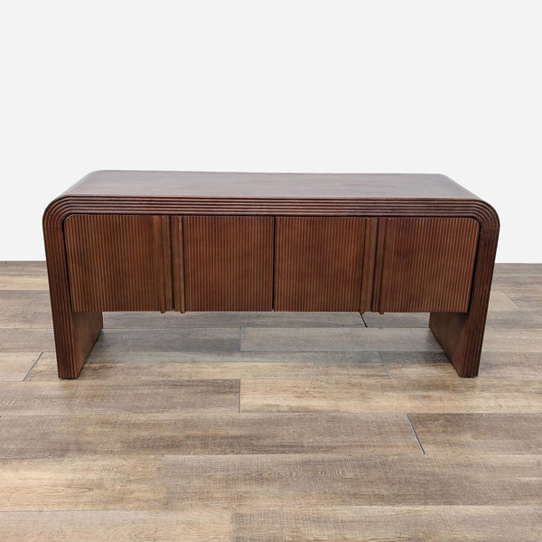 a mid century modern walnut coffee table