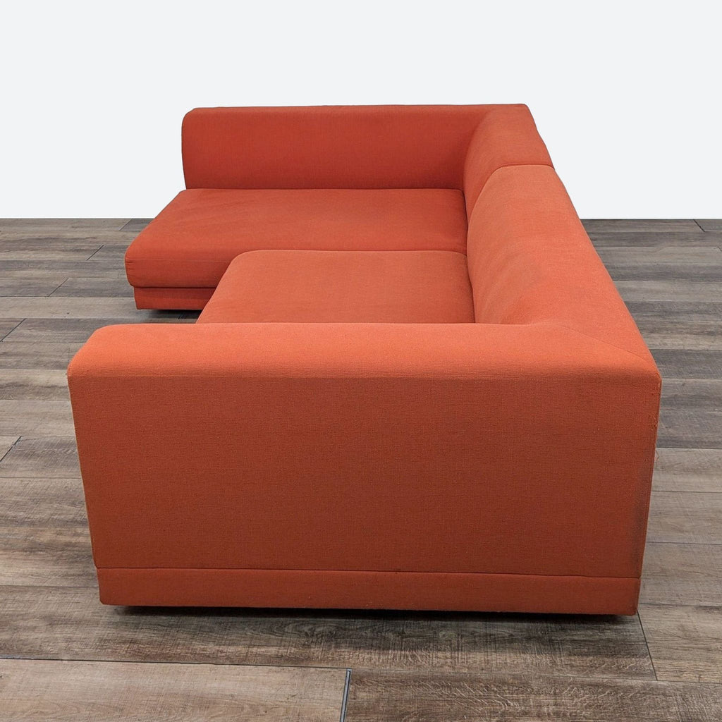 sofa is a modern sofa that is made of solid wood and has a square shape. the sofa