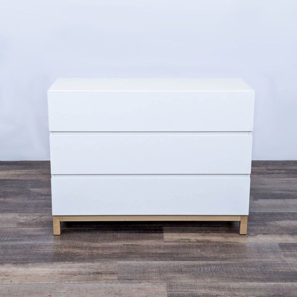 the white chest of drawers