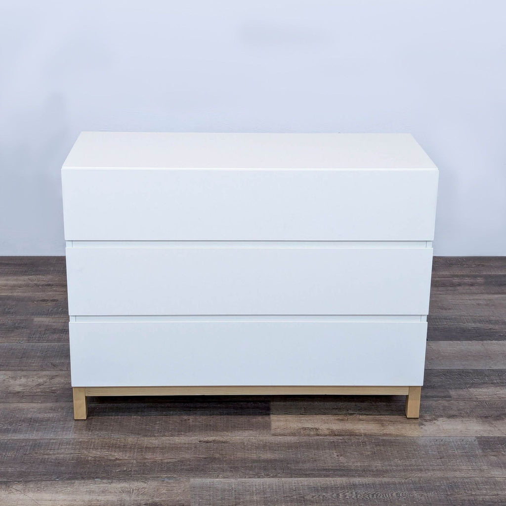 white chest of drawers with a white finish