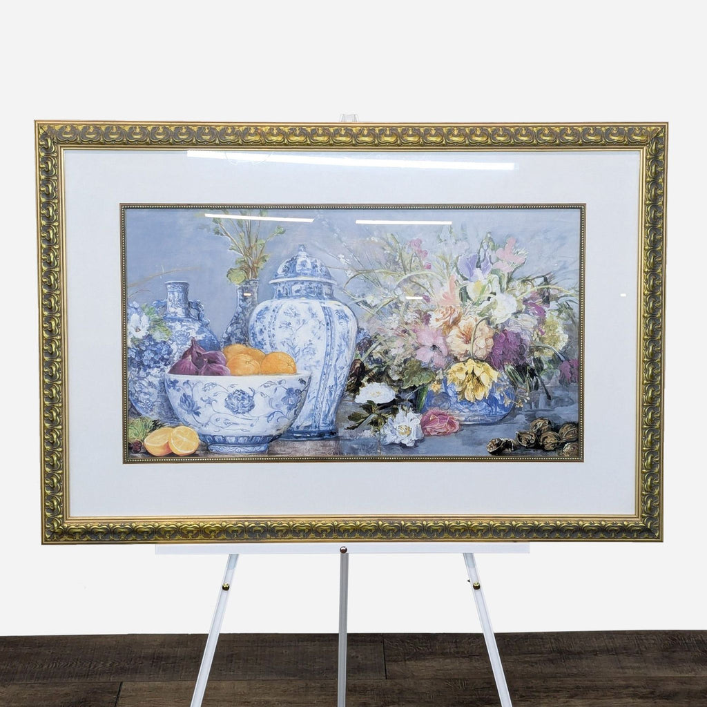 a framed painting of a vase of flowers and fruit