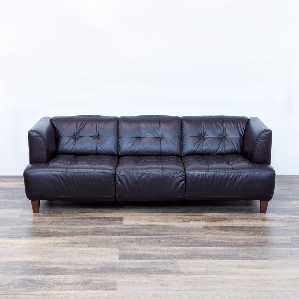 a large leather sofa in the style of [ unused0 ]