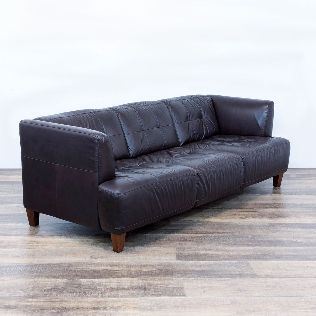 a leather sofa by [ unused0 ].