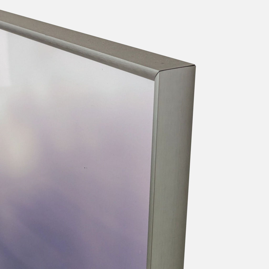 a metal frame with a clear finish.