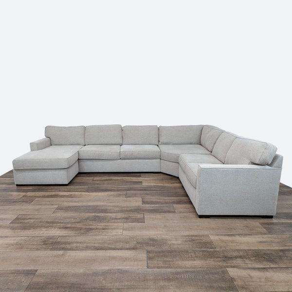 sectional sofa is a modern design that is made of soft grey fabric. the sectional sofa is made