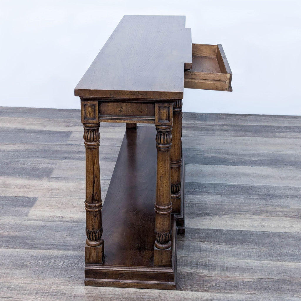 a solid walnut table with a drawer and a shelf.