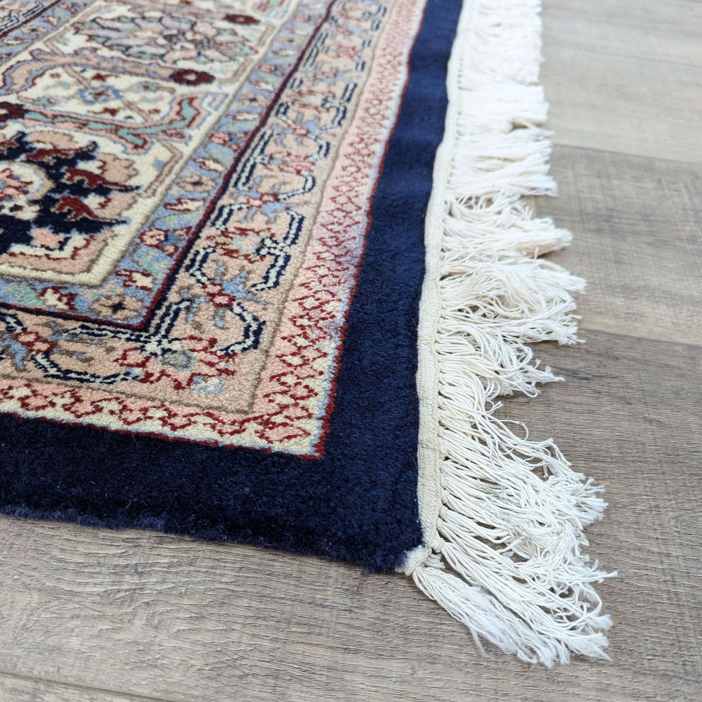 a close up of a blue and white persian rug