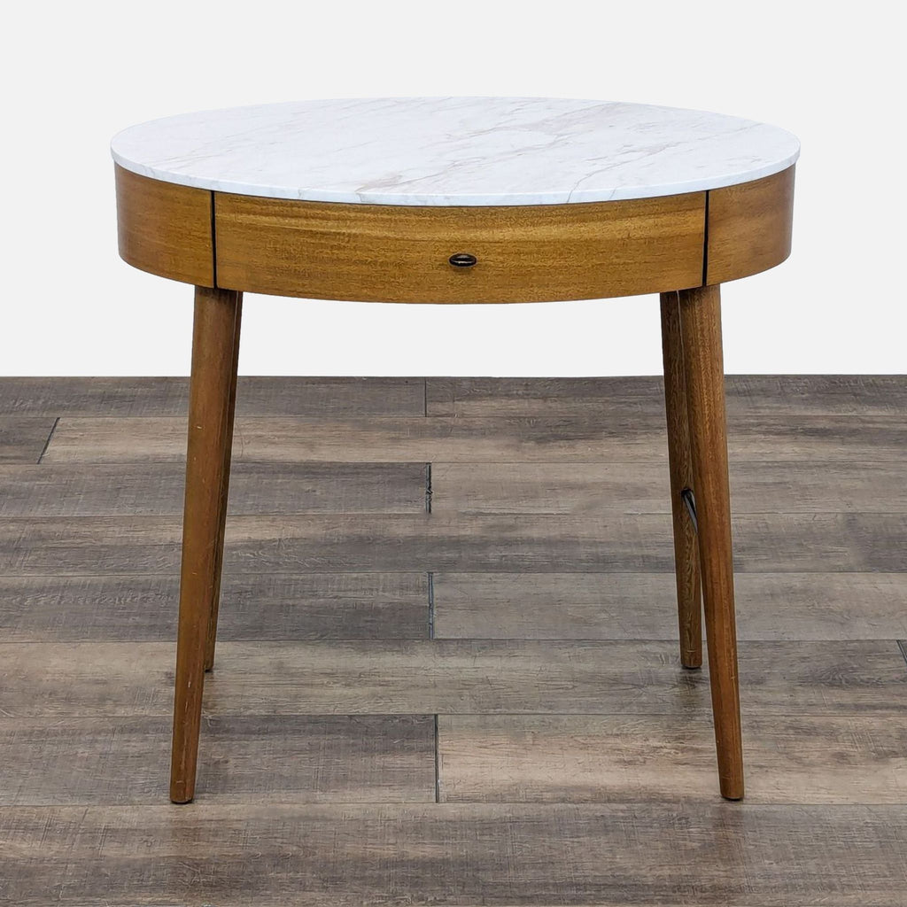 a round coffee table with a marble top