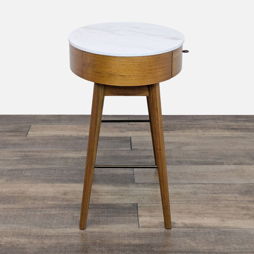 a small side table with a marble top