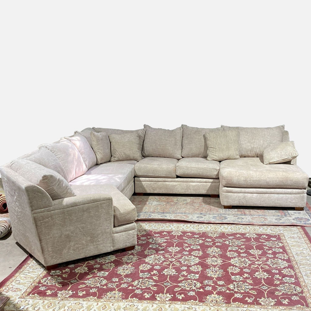 a large modern sectional sofa with a matching ottoman