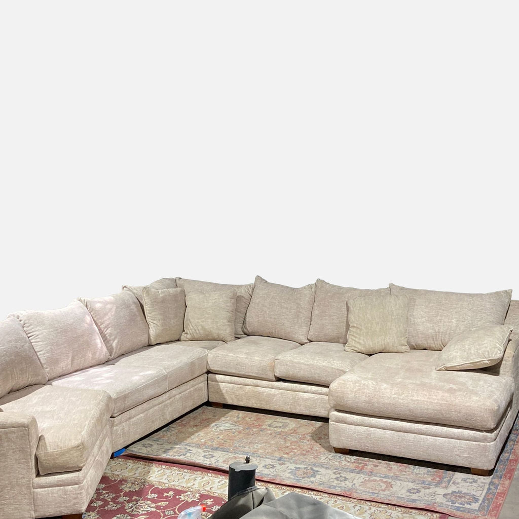 a large sectional sofa with a large square shape and a large square shaped cushion.