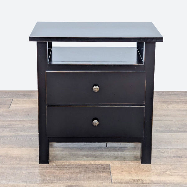 a pair of bedside tables with drawers