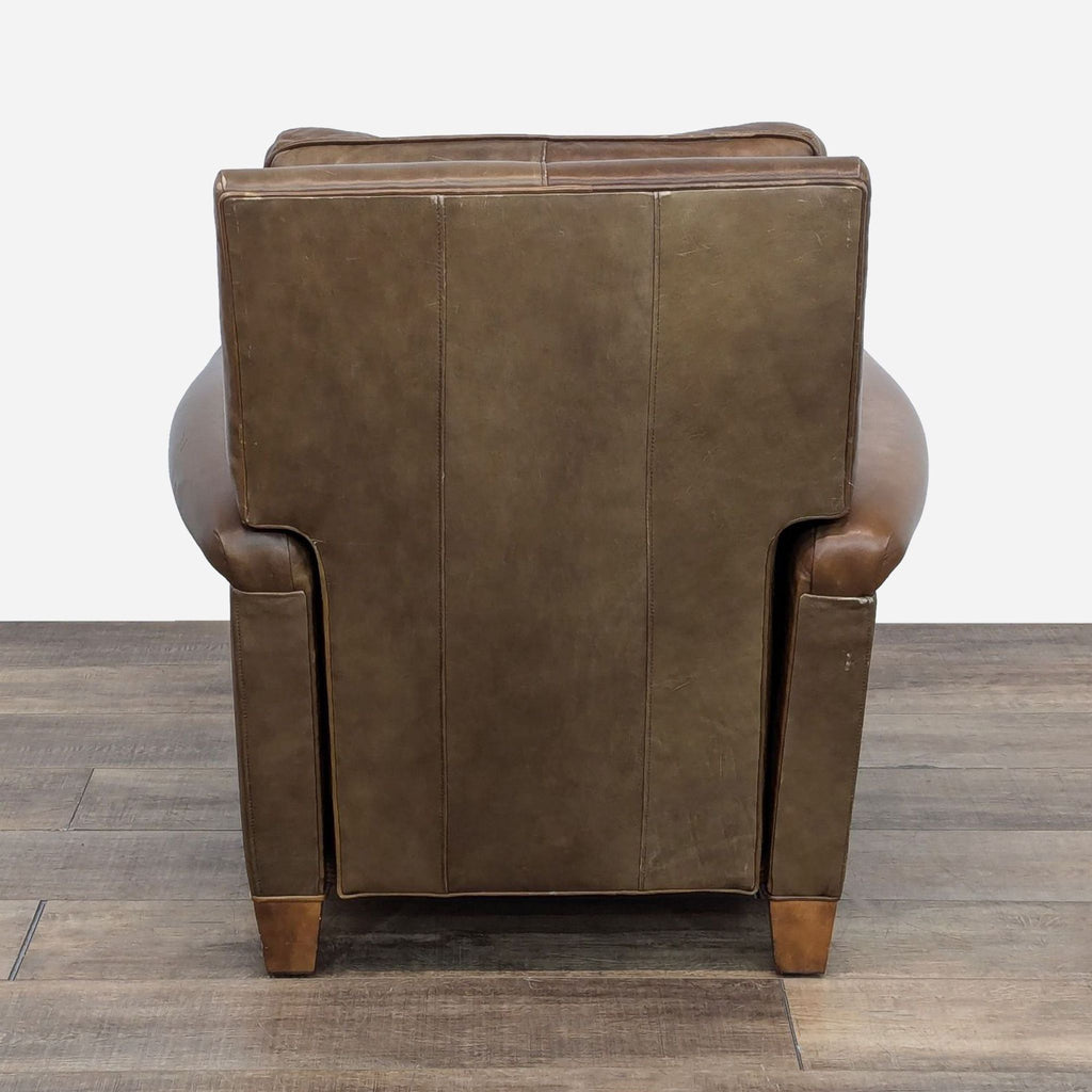 a leather club chair with a backrest