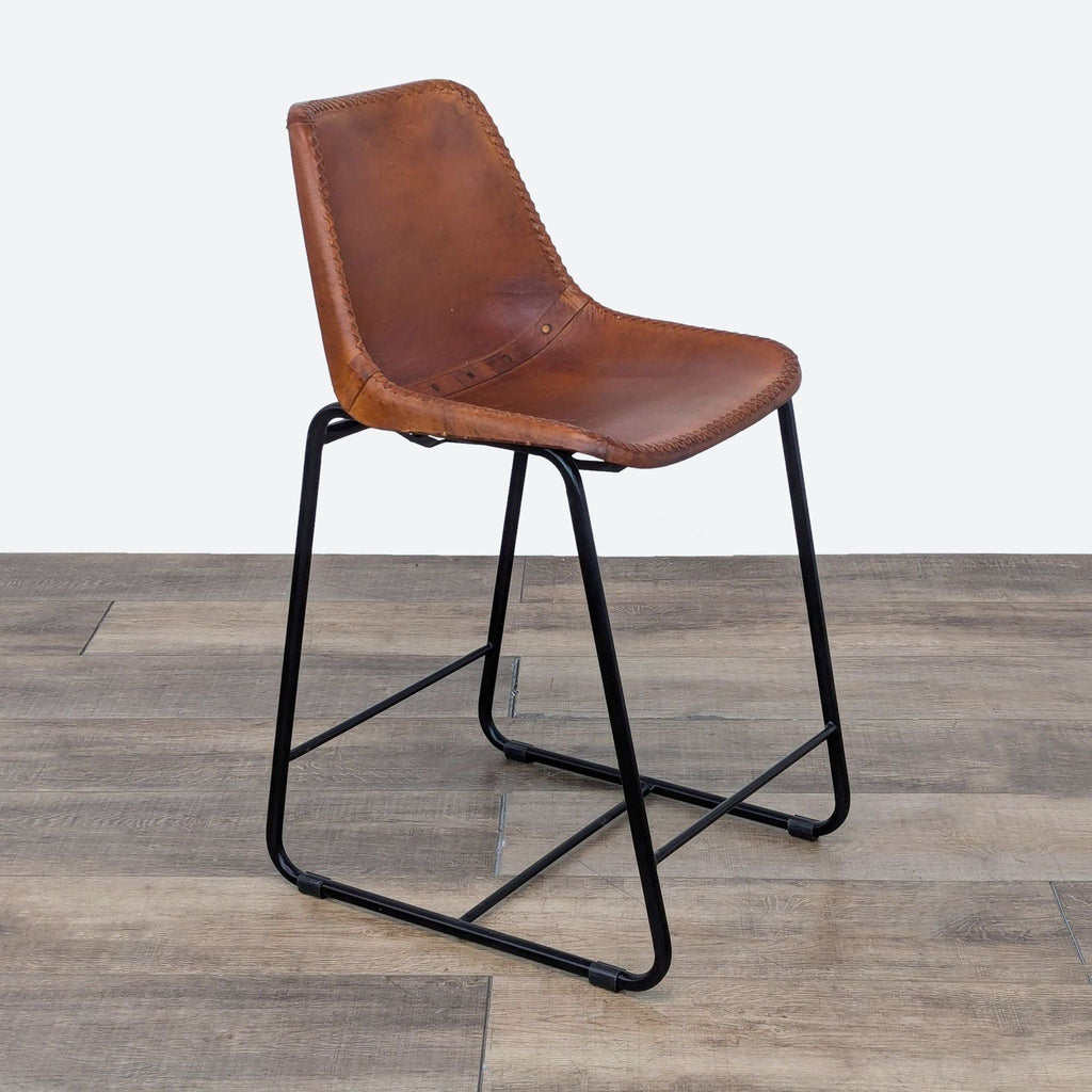 the [ unused0 ] stool is made of leather and is made from a single piece of leather