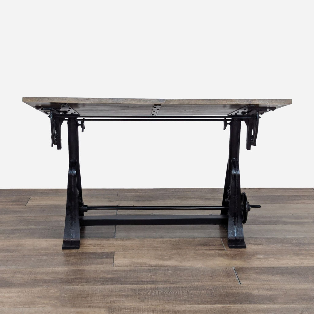 a black iron and wood table with a black iron base.