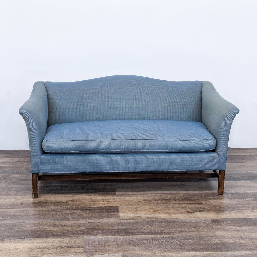 a blue sofa with a blue upholstery.